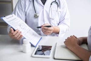 Medical doctor explaining chart to patient in Birmingham 