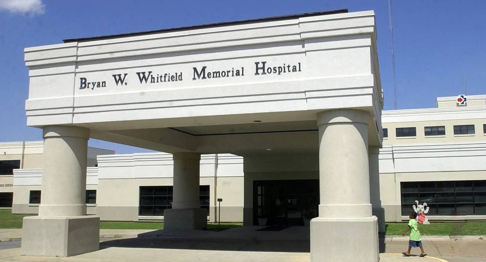 Front entrance of a hospital building featuring a covered portico and columned entryway. (Photo courtesy of Rehabs.org)