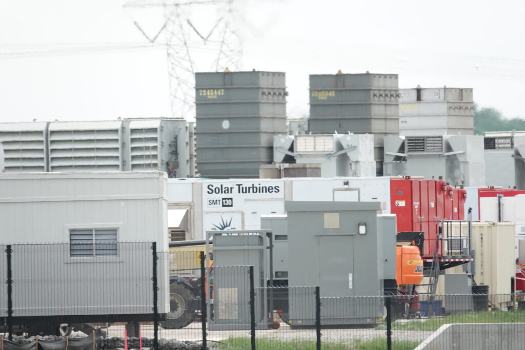 xAI's Colossus data center in Memphis, which powers the AI chatbot Grok, illustrates the surging power demand driving new transmission line and eminent domain disputes. (Photo: Karen Pulfer Focht/Tennessee Lookout)